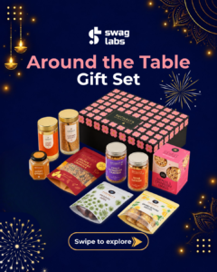 Around the Table gift set with biscotti, granola, dates, cookies, crackers and spreads beside a pink floral box